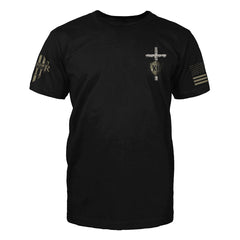 The front of "The Lord Is My Strength" featuring small chest print of a cross with a shield on the upper left side.