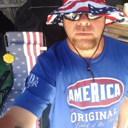 Happy customer celebrating while wearing his America-The Original t-shirt.