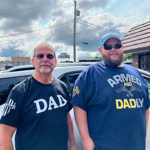 Two of our wonderful customers enjoying Father's Day in their Armed and Dadly and Dad Defined t-shirts.