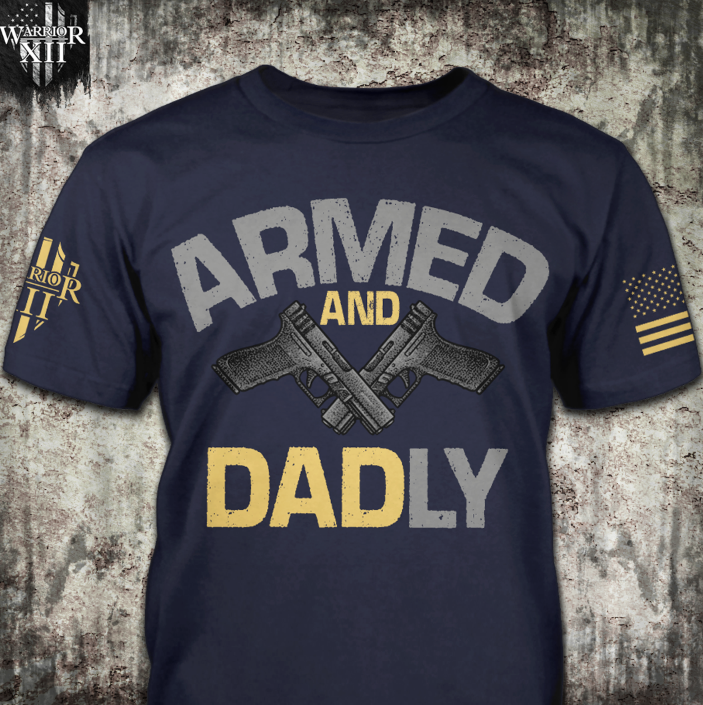 Navy t-shirt with the words "Armed and Dadly" Under the word armed, is a set of black handguns and then 'Dadly' written below the guns with the word DAD being in a yellow with a grey L and Y